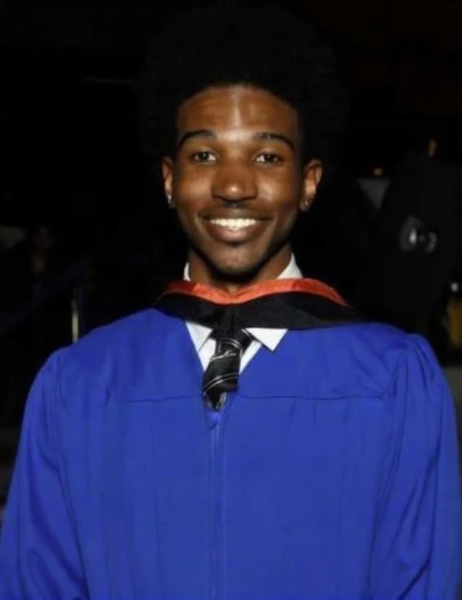 Kaleel wearing his graduation gown